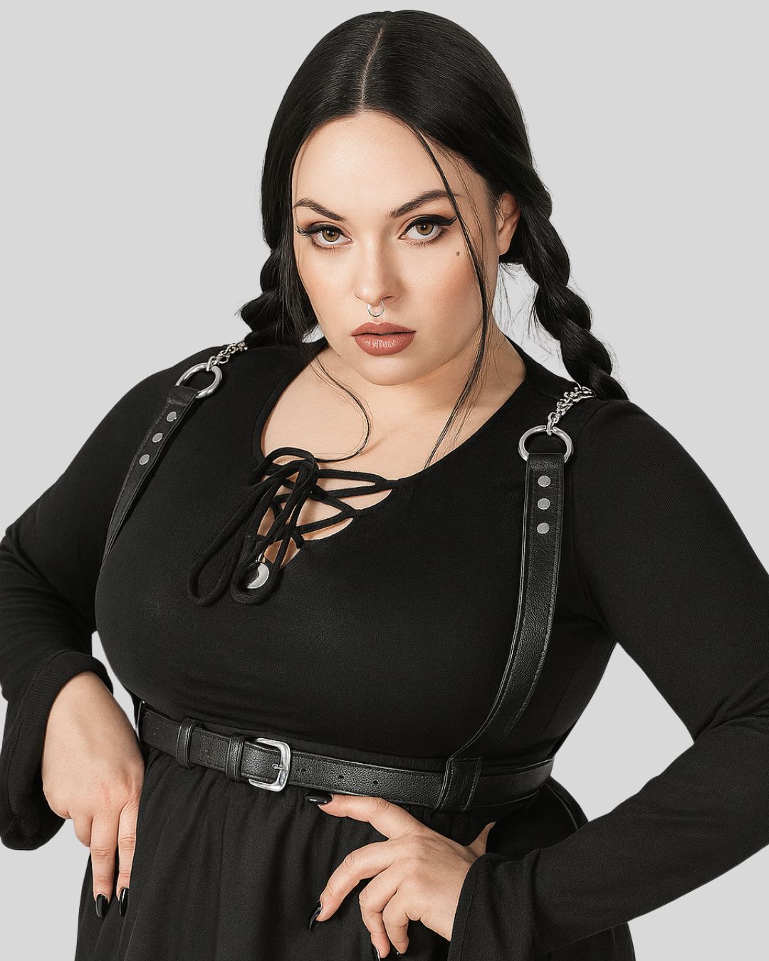 black leather chain body harness with vertical strap and silver buckle laid flat